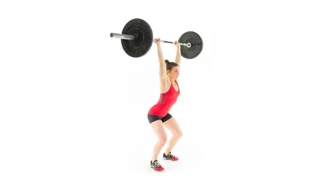 Atleta femenina ejecutando un jerk overhead con barra, variante de press del levantamiento olímpico para desarrollar potencia desde extremidades inferiores hasta superiores con triple extensión